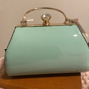 Mint green patent leather purse.